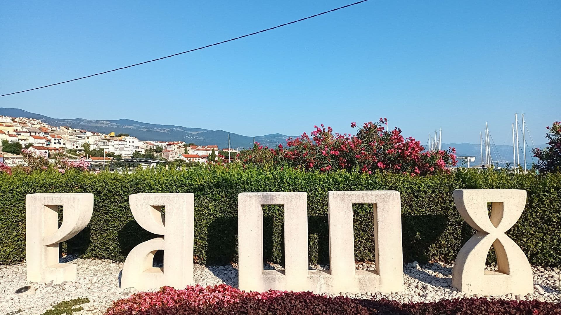 Glagolitic script sculpture at the entrance to Novi Vinodolski, Croatia